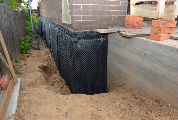SJ Waterproofing Pros technician performing targeted Exterior Waterproofing assessment in Manchester, TN